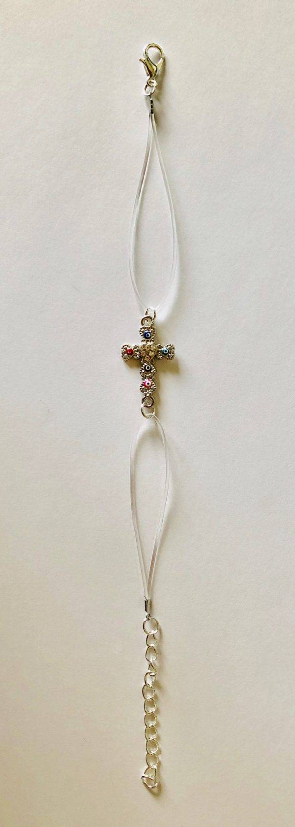 Bracelet métal argenté/fil transparent - croix strass blancs et émail